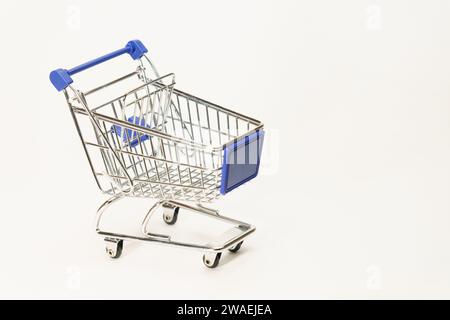 metal shopping cart with wheels, empty, isolated on white background Stock Photo