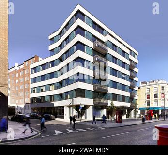 Corner elevation of building across intersection. Westbourne House, London, United Kingdom. Architect: Stiff + Trevillion Architects, 2015. Stock Photo