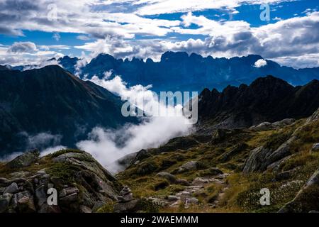 The main range of Brenta Dolomites, clouds moving around in the valleys, seen from the mountain hut Rifugio Cornisello. Stock Photo