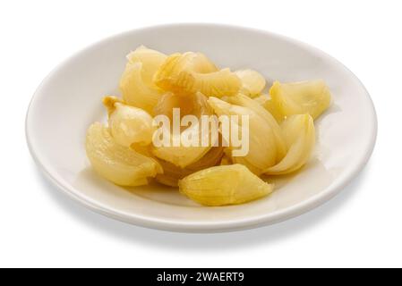 Cooked onions seasoned with olive oil in white plate isolated on white with clipping path included Stock Photo