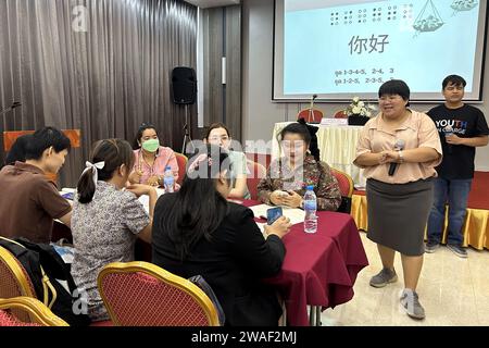 (240104) -- BANGKOK, Jan. 4, 2024 (Xinhua) -- Thai blind school teachers and Chinese language teachers participate in the Chinese Braille textbook training organized by the Thailand Association of the Blind in Pattaya, Thailand, July 23, 2023. After two months of compilation and revision, the Chinese Braille textbooks were completed in the middle of last year and the first batch of 300 copies were printed with the funding of Bank of China (Thailand) for training teachers in Thai blind schools. TO GO WITH 'Thailand publishes Chinese Braille textbooks to help visually impaired students learn Stock Photo