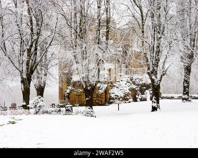 Castle grounds covered in snow and the Kings Tower through trees in Castle Yard Knaresborough North Yorkshire England Stock Photo