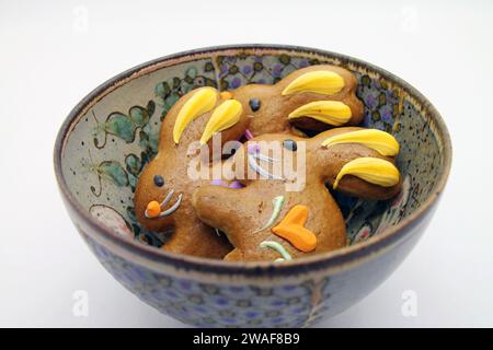 Easter gingerbread cookies in the shape of a bunny in a bowl. View from above. Stock Photo
