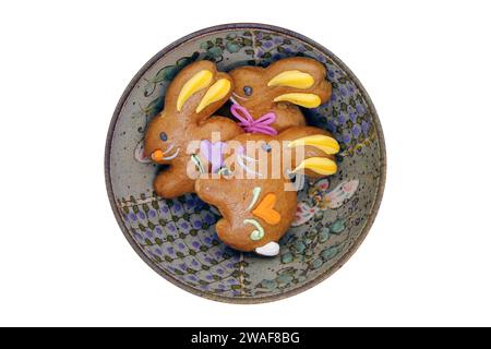 Easter gingerbread cookies in the shape of a bunny in a bowl. View from above. Stock Photo