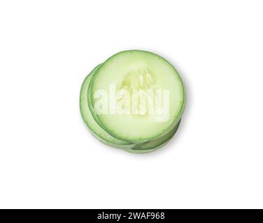 Top view of Fresh green cucumber slices in stack are isolated on white background. Stock Photo