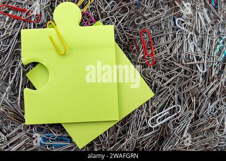 Background from multi-colored paper clips. Office tools. Paper form with empty space for inscription Stock Photo