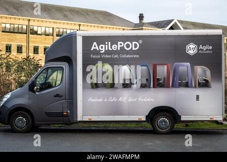 AgilePOD acoustic office space pods advertised on AgileAcoustics company van in Salts Mill Stock Photo
