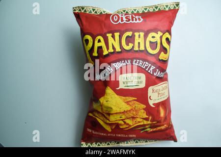 Oishi Panchos spicy corn flavor. Oishi brand is a manufacturer of food and drink products isolated on white background. Bekasi, Indonesia, Januay 4, 2 Stock Photo