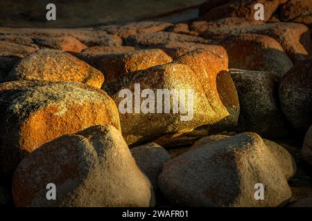 The coastal rock in shades of orange and grey Stock Photo
