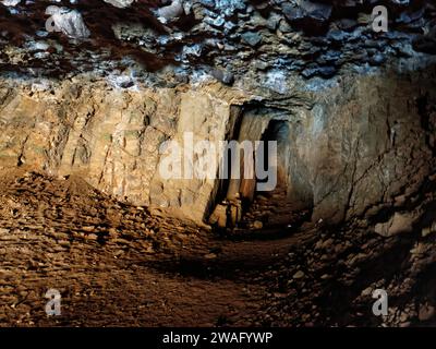 Tunnel excavated in volcanic rocks at rear of a sea cave in the Black Cove / Caleta Negra, Natural Monument of Ajuy (Peurto de la Pena), Fuerteventura Stock Photo