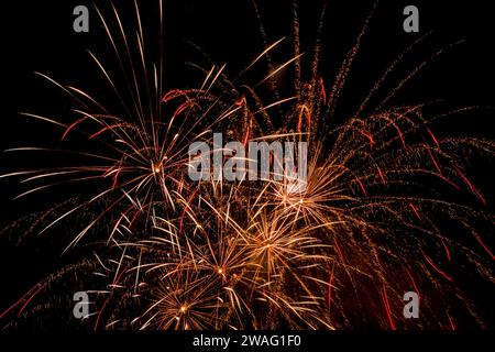 A fireworks display against the night sky Stock Photo