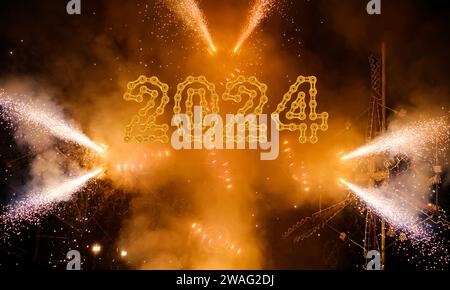 Close up group of several festive firework sparklers with 2024 Happy New Year made from chain links Stock Photo