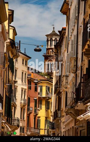 Streets of Verona (Veneto) city in Italy, lots of heritage and historical buildings and ancient architecture, streets filled with tourists Stock Photo