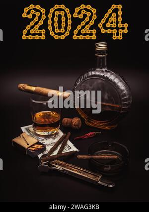 Quality cigars with cognac, cutter, 100 dollar paper, ashtray, red hot pepper and 2024 Happy New Year made from golden chain links on black background Stock Photo