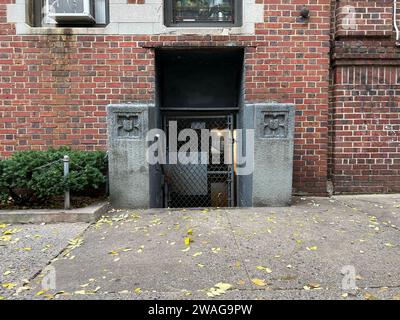 A red brick building with a metal doorway Stock Photo