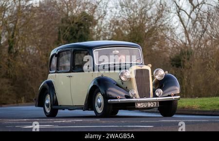 Stony Stratford,UK Jan 1st 2024.1938 Austin vintage car arriving at Stony Stratford for the annual New Years Day vintage and classic vehicle festival. Stock Photo