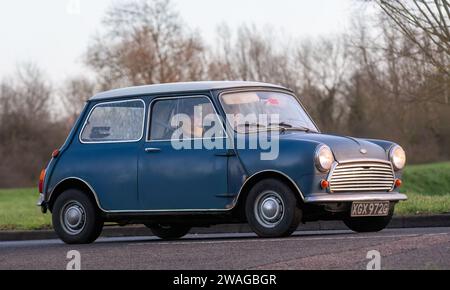 Stony Stratford,UK Jan 1st 2024. 1968 blue Mini Cooper car arriving at Stony Stratford for the annual New Years Day vintage and classic vehicle festiv Stock Photo
