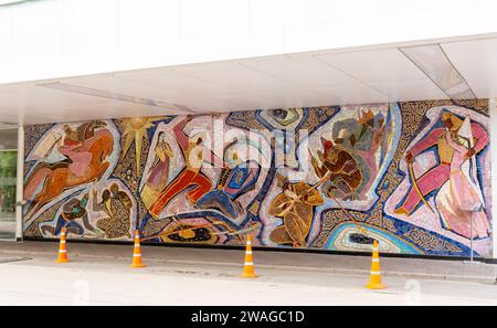 "Enlik-Kebek" mosaic on Almaty hotel facade. Authors: Author Kenbaev M; Tsivchinskiy N. 1965. Almaty Kazakhstan Stock Photo