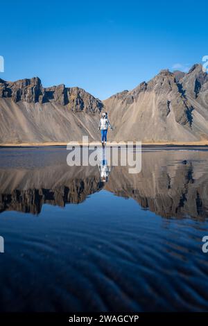 Woman posing on Stokksnes beach, Iceland Stock Photo