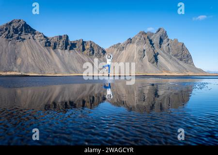 Woman posing on Stokksnes beach, Iceland Stock Photo