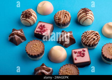 photo, an exquisite set of chocolate candies steals the spotlight. This assortment of assorted truffles presents a delightful collection of sweet temp Stock Photo