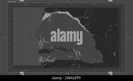 Senegal highlighted on a Bilevel elevation map with lakes and rivers map with the country's capital point, cartographic grid, distance scale and map b Stock Photo
