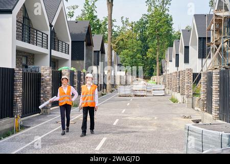 Team of building professionals inspecting together construction object Stock Photo