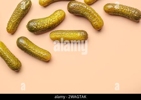 Pickled cucumbers on orange background Stock Photo