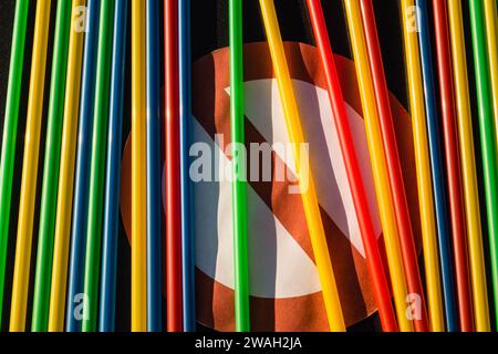 colorful plastic straws on probibition sign Stock Photo