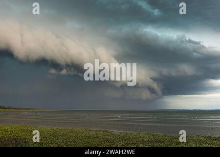 Storm front with localised heavy rain and gale-force winds passing over Lake Chiemsee, Germany, Bavaria, Lake Chiemsee Stock Photo