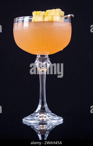 Only fans Martini cocktail garnished with pineapple cubes Stock Photo