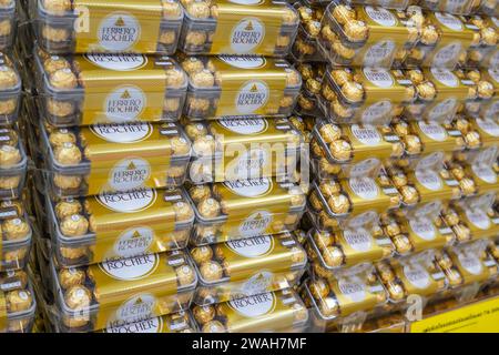 Boxes of Ferrero Rocher collection chocolate in grocery store. Ferrero Rocher is a spherical chocolate produced by the Italian chocolatier. Thailand, Stock Photo