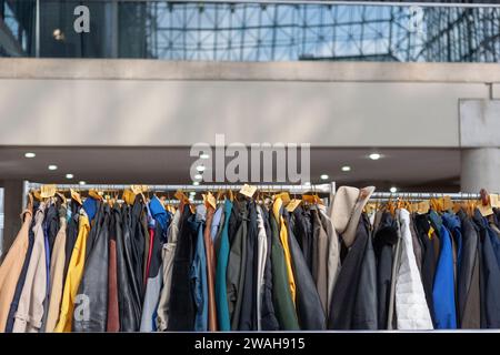 Checked in coats on hanger at Jacob Javits Convention Center, New York City Stock Photo