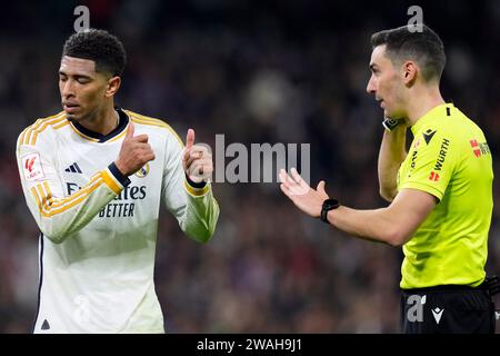 Madrid, Spain. 03rd Jan, 2024. Jude Bellingham of Real Madrid CF and referee Alejandro Muniz Ruiz during the La Liga match between Real Madrid and RCD Mallorca played at Santiago Bernabeu Stadium on January 3, 2024 in Madrid, Spain. (Photo by Cesar Cebolla/PRESSINPHOTO) Credit: PRESSINPHOTO SPORTS AGENCY/Alamy Live News Stock Photo