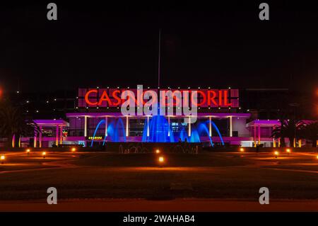 Facade of the Casino Estoril at night in Estoril city, near Lisbon, Portugal. One of the largest casinos in Europe majority-owned by Dr. Stanley Ho. Stock Photo