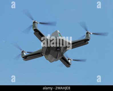 Military Drone euipped with surveillance camera flying in the sky.3D rendering image. Stock Photo