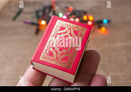 Islamic Holy Book Quran with lights behind Stock Photo