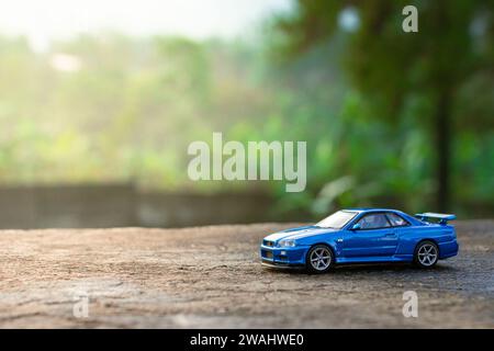 Blue Nissan Skyline GTR R34 parked after the rain showing its tuning ...