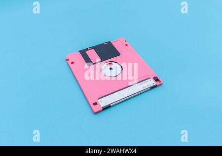 A floppy disk isolated on blue background. After some edits. Stock Photo