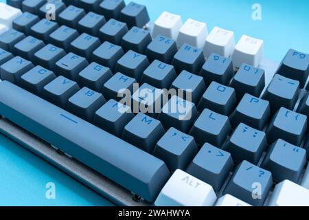 Mechanical keyboard isolated on blue background. After some edits. Stock Photo