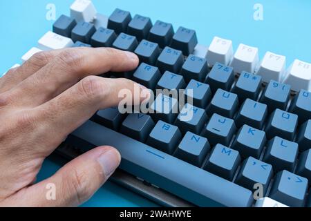 Mechanical keyboard isolated on blue background. After some edits. Stock Photo