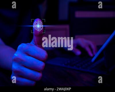 Fingerprint scan icon on virtual screen while finger scanning for security access with biometrics identification while use computer. Cybersecurity, pr Stock Photo