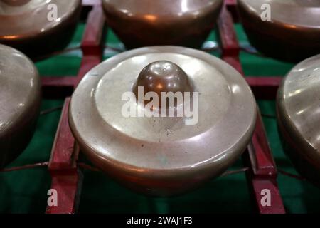 Kenong is also one of the traditional musical instruments in Central Java that composes gamelan instruments. Kenong is generally hit by a bat. Stock Photo