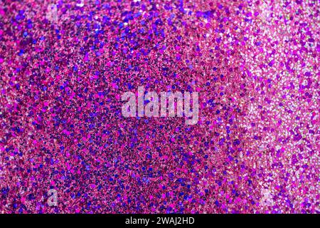 Defocused shimmering pink glitter texture background with vibrant color and bokeh Stock Photo