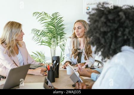 Professional businesswoman leading a business meeting in the office. Business concept. Stock Photo