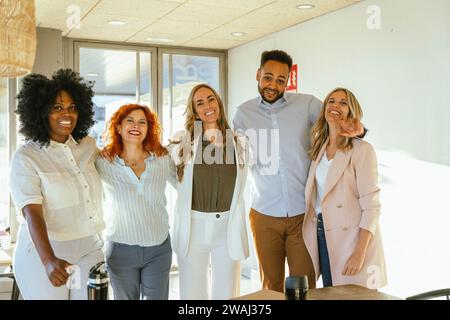 Group of diverse business people smiling while posing together in the office. Business concept. Stock Photo