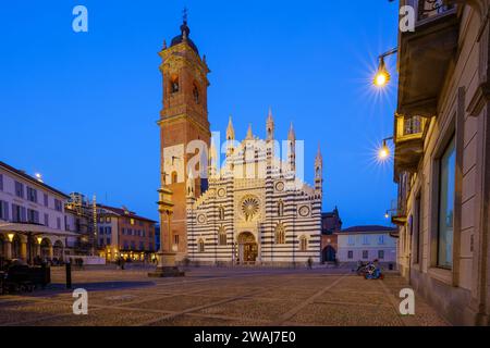 Monza, Italy - February 25, 2023: Evening view of the cathedral (Duomo, Basilica di San Giovanni Battista), with visitors, in Monza, Lombardy, Norther Stock Photo