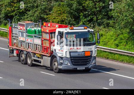 BOC, Linde Group Industrial Gases being transported on a DAF LF HGV on the M6 near Lancaster, UK Stock Photo