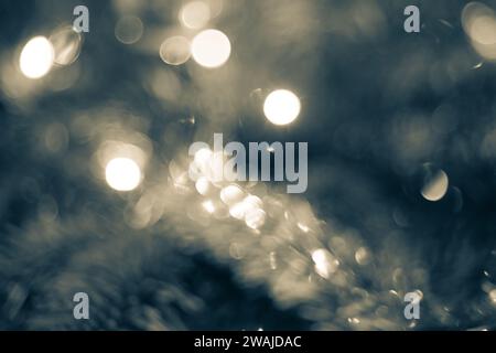 A vibrant and blurred Christmas-themed background with festive lights in soft focus Stock Photo