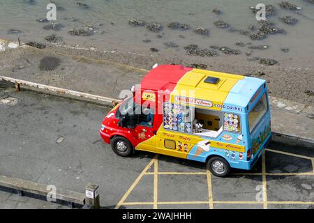 Caernarfon, Wales, United Kingdom - May 1 2017: Colourful Ice Cream Van on street serving ice cream, aerial view Stock Photo